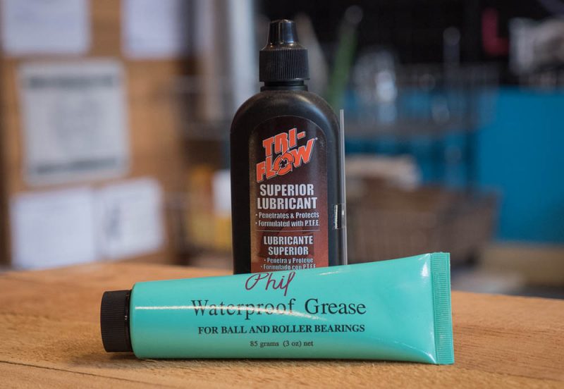 A bottle of Tri-Flow and a bottle of Phil Waterproof Grease